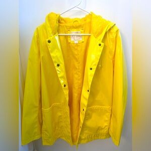 Yellow raincoat with polka dot lining